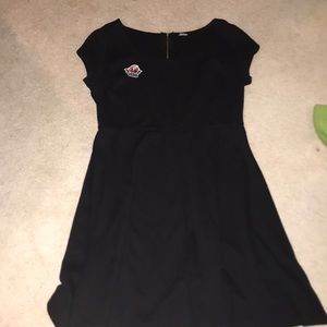 black dress with a vans rose patch